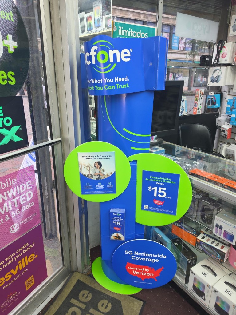 Tracfone stand with bilingual plan signage