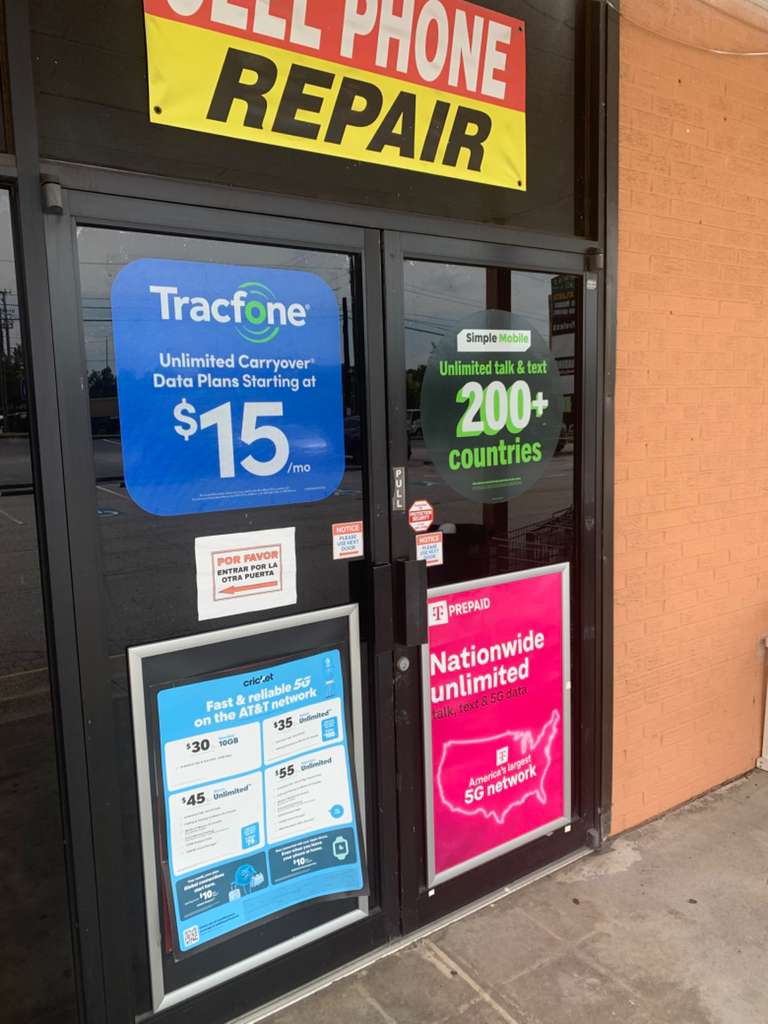 Cell phone repair entrance with carrier door ads