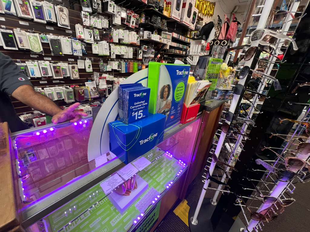 Store counter with Simple Mobile and Tracfone displays