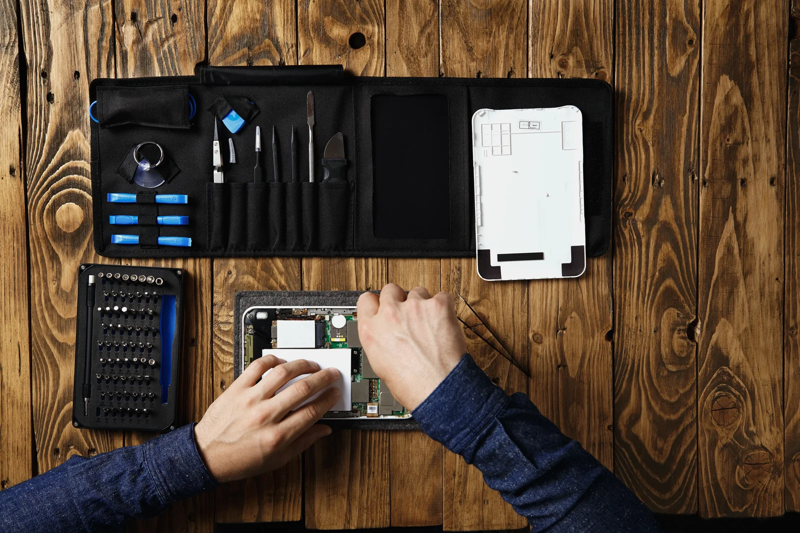 Phone repair technician working on device